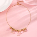 Detail of gold breast cancer awareness necklace with pink ribbon pendant and pearls - Gold Pink Ribbon Multi-Pendant Choker (G-296)