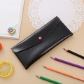 Detail of black laser pencil case with pink button closure and glitter texture finish - Glitter Black