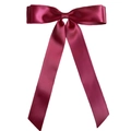 Close-up of elegant wine red satin ribbon double bow hair clip with long flowing streamers - Burgundy