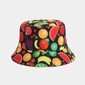 Close-up of vibrant tropical fruit print patterns on a black canvas sun bucket hat - Mixed Fruit Black