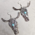 Close-up of Western style bull head earrings with leopard print leather and turquoise - 6-Multi-colored Mixed Fur