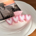 Pink heart-shaped acetate hair claw clip with four hearts in a soft macaron finish - Pink