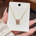 Elegante collana in titanio dorato con ciondolo a cilindro in strass viola da donna - Stile pendente a cilindro con gemma viola (X613) / Oro
