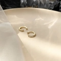 Minimalist gold ear cuff pair with sparkling cubic zirconia on a beige ceramic plate - C-Shape 5-Diamond Pair (448) / Gold