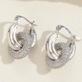 Macro shot of silver interlocking hoop earrings with micro-pave white zircon stones - Silver Double Hoop Zirconia Style (ES2343-4)