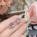 Detail of pink heart gemstone earring with zircon halo and small cross in 18K gold - 0172 Pink Heart Saturn Cross Studs
