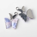 Detailed macro view of purple and pink pearlescent butterfly pendant with metal back - Silver Base Purple