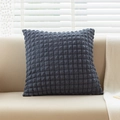 Solid navy blue waffle texture cushion placed on a sofa in a modern minimalist living room - 45x45cm / Dark Gray