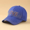 Detailed view of blue baseball cap with shiny 'LOVE' rhinestone lettering - One Size / LOVE Blue