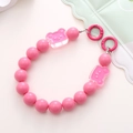 Detailed view of pink acrylic bear beads and metal ring clasps for phone or bag strap - Deep Pink Bear Style (K1671)