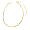 Detail of gold tennis necklace showing yellow zircon stones and heart-shaped chain extender - Yellow