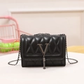 Elegant black quilted leather shoulder bag with metallic V-logo and fringe tassel details - Black
