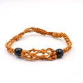 Detail of the handmade orange woven rope bracelet with black spherical resin beads - Bracelet / Coffee