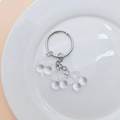 Detail showing a transparent cherry pendant with a silver metal ring and chain - Clear Cherry (No Buckle)