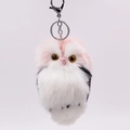 Close-up of fluffy faux rabbit fur owl keychain with pink and white plush texture - Light Pink