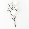 Detail view of artificial Christmas branches with white and silver berry foam ornaments - White