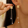 Long gold four-leaf clover tassel earrings with white pearls on a female model - Gold (Four-leaf Clover Pearl)