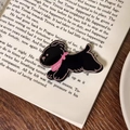 Cute black enamel puppy hair clip with pink scarf on a vintage book background - Black Puppy