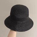 Detailed view of the black hand-woven raffia texture on a summer sun bucket hat - 10cm Brim / Black