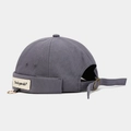 Detail of dark grey canvas docker cap showing metal ring and woven label accents - Adjustable / Ring Letter Patch Haze Blue