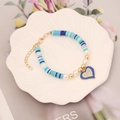 Close-up of blue clay disc bracelet with heart enamel pendant and sparkling crystals - 6# Mixed Blue