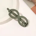 Detail shot of a matte olive green infinity hair clip on a minimalist textured background - Infinity - Army Green