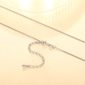 Detail of silver box chain necklace featuring a spring clasp and teardrop pendant - XL1186 Box Chain