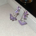 Macro detail of three purple zircon butterflies set in silver ear cuff earrings - Silver Purple Butterfly Ear Clip (28#)