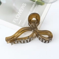 Translucent amber resin bow hair claw clip for thick hair in a minimalist style - Tea Green