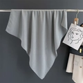 Close-up of soft light blue-grey cotton linen square scarf draped on a metal hanger - Light Gray