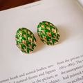 Vintage green enamel earrings in golden oval scale design on a book background - Green Scales (27# Silver Pin)