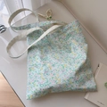 Dettaglio della borsa in tela floreale con fiori gialli e viola e manici in cotone - Piccolo Floreale Giallo Verde