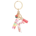 Cute letter K resin keychain with colorful fruit slices and a pink tassel charm - Letter K