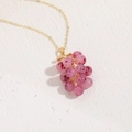 Fashionable purple resin grape pendant necklace with a detailed gold chain finish - Grapes