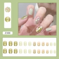 Press-on nail kit featuring fresh mint green, champagne gold glitter, and green rhinestones - Honeydew Milk Green (Glue Style)