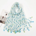 Close-up of white linen scarf featuring blue floral prints and two-tone fringe tassels - White Base Blue Ball Flower Style (XB1051)