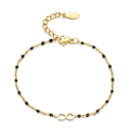 Close-up of gold infinity charm bracelet with black beads and adjustable lobster clasp - Black
