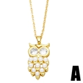 Elegant gold owl pendant necklace with sparkling cubic zirconia eyes and white pearls - Gold Owl
