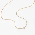 Minimalist golden necklace with a round-cut clear zircon pendant in four-prong setting - Single Zirconia Round Style (KD1520)
