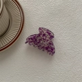 Detailed view of a purple floral marble acetate hair claw clip on a white texture - Ghost Hand Claw / Floral Purple