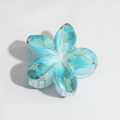 Detail of blue marble lily hair claw clip with golden veins and resin petal texture - Marble Light Blue