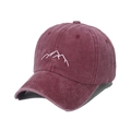 Close-up of a washed burgundy baseball cap featuring white mountain peak embroidery details - Burgundy