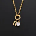 Collier en acier inoxydable plaqué or 14K avec lettre n et pendentif en cz brillant - Lettre N