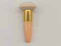 Beige mushroom sponge makeup brush with gold ferrule and nude tapered handle - Nude