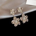 Detail view of silver floral earrings with double petal layer on grey silk background - Double Flower Nesting Dangle / 23# Silver Post-Silver-Two Flowers