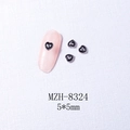 Macro detail of silver heart-shaped nail charms with metal edging, size 5x5mm - 8324 Silver Border Black Heart (5*5mm)