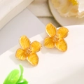 Macro shot of yellow floral earrings with gold edges and beaded centers on a white base - 03 Yellow KC Gold