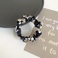Elegant leopard print silk scrunchie in black and gold tones for women hair styling - Black Leopard
