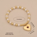 Bracciale di perle dorate e bianche con ciondolo a cuore rosso e misure del prodotto - Bracciale a Cuore Con Bordo in Strass (2#)