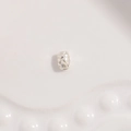 Macro shot of silver barrel spacer bead with elegant diamond quilted texture for jewelry - Small Diamond Pattern / 2.5x3.5mm / Silver